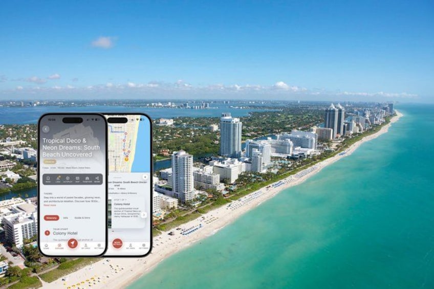 A coastal cityscape with a clear view of a beach and high-rise buildings. 1