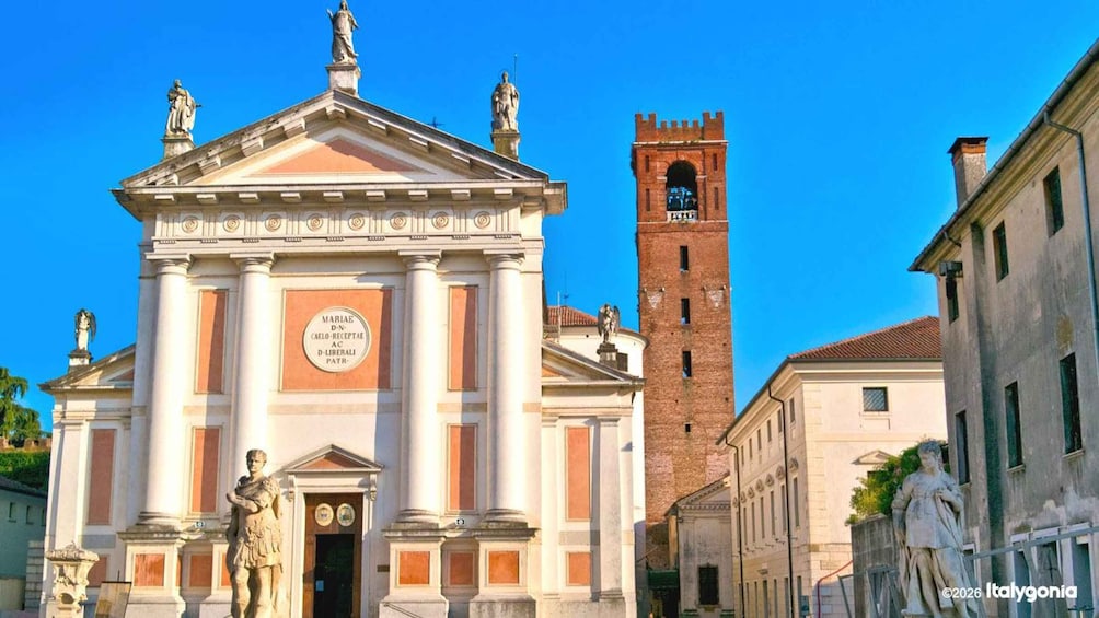 A historical building with classical architecture, a bell tower, and statues. 3
