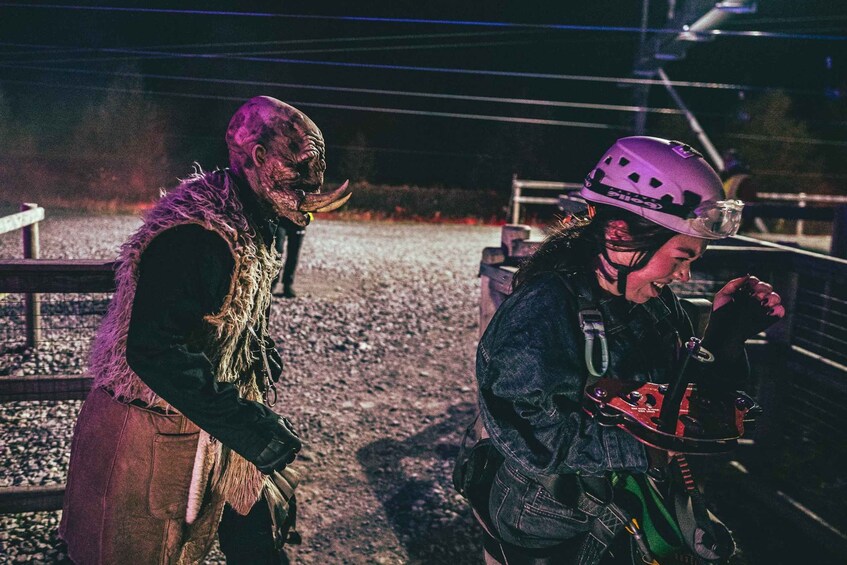 A person in a costume with a helmet and a person in a helmet with a backpack. 3