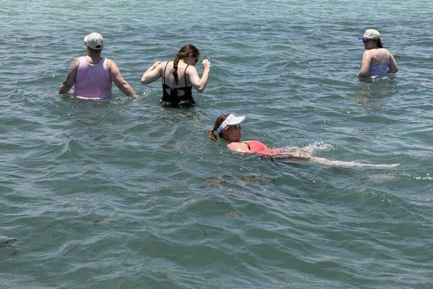 People swimming in a body of water. 2