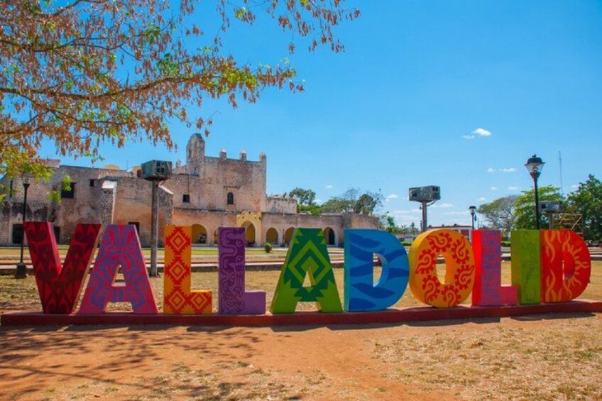 Colorful letters spelling 'VALADOLID' with a historic building in the background. 4