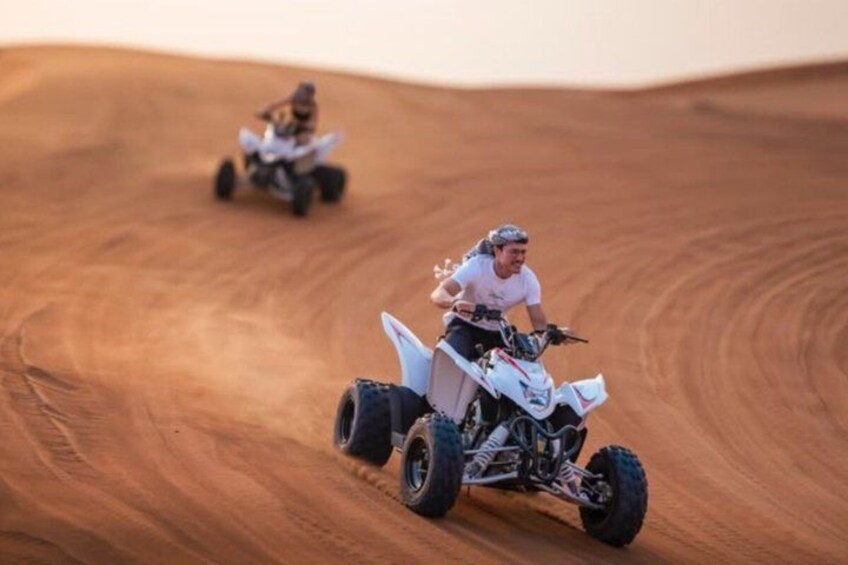 Two off-road vehicles on a sandy dune. 4