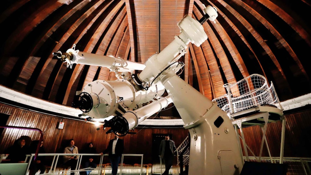 A large telescope inside a dome structure. 3