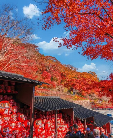 A traditional Japanese market with red lanterns and autumn foliage. 2