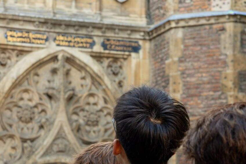 A Gothic architectural structure with intricate carvings and inscriptions. 5