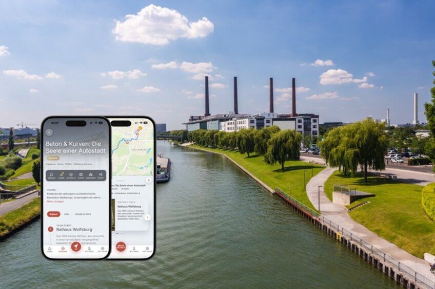 A river with a bridge, a riverboat, and a large industrial building with smokestacks in the background. 1