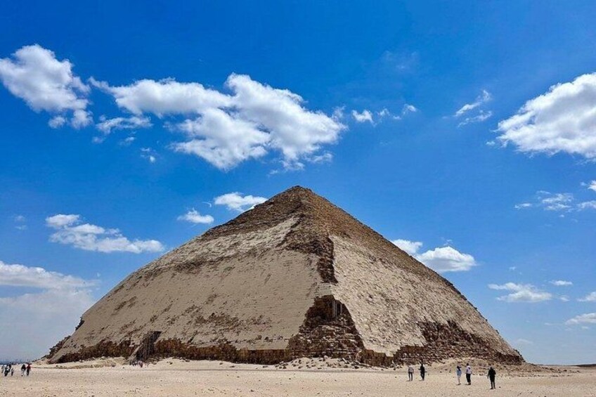 A large pyramid in a desert with a clear sky. 3