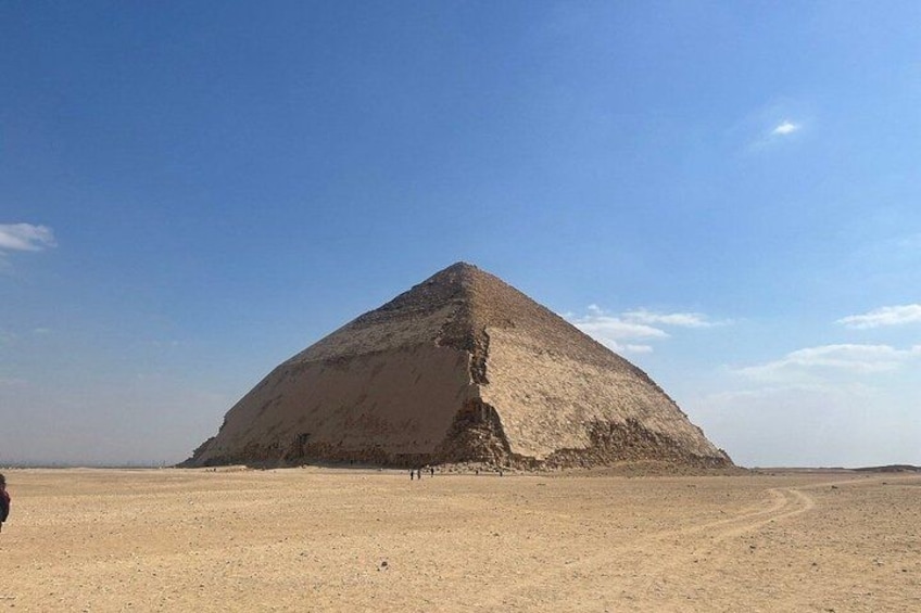 A large pyramid in a desert landscape. 5