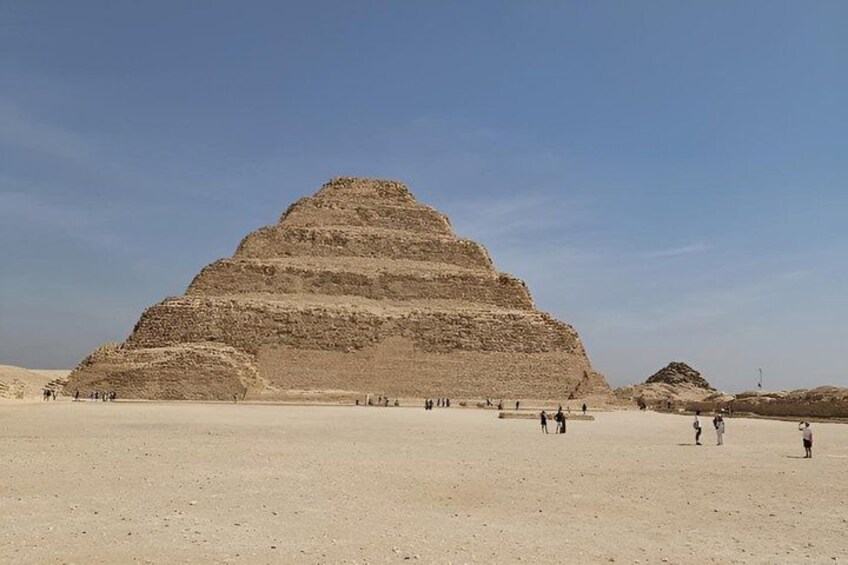 A large pyramid in a desert with a clear sky. 2