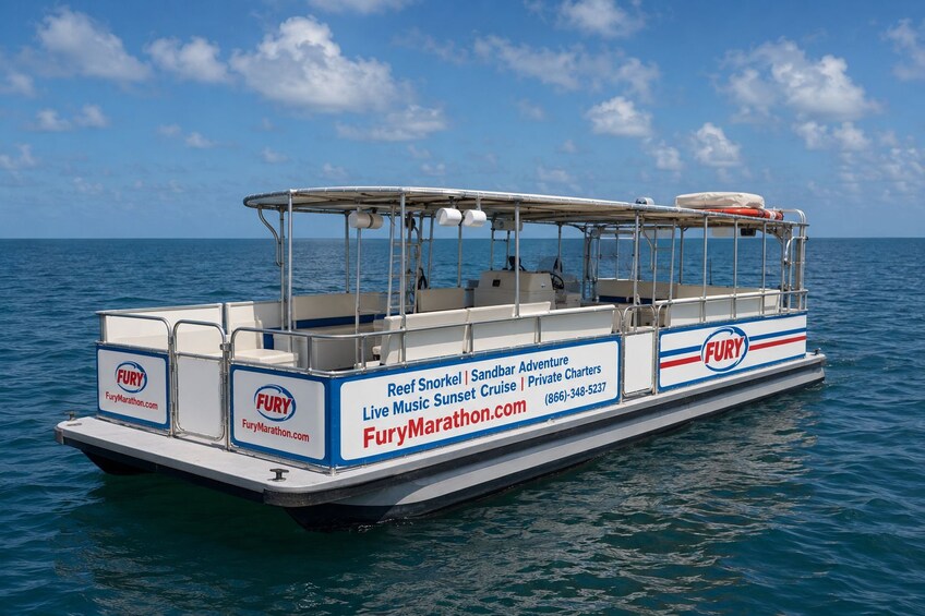 A boat with 'FURY' branding and 'Reef Snorkel | Sandbar Adventure | Live Music Sunset Cruise | Private Charters' on its side. 5