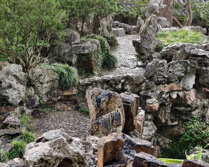 A rocky garden with a stone pathway. 1
