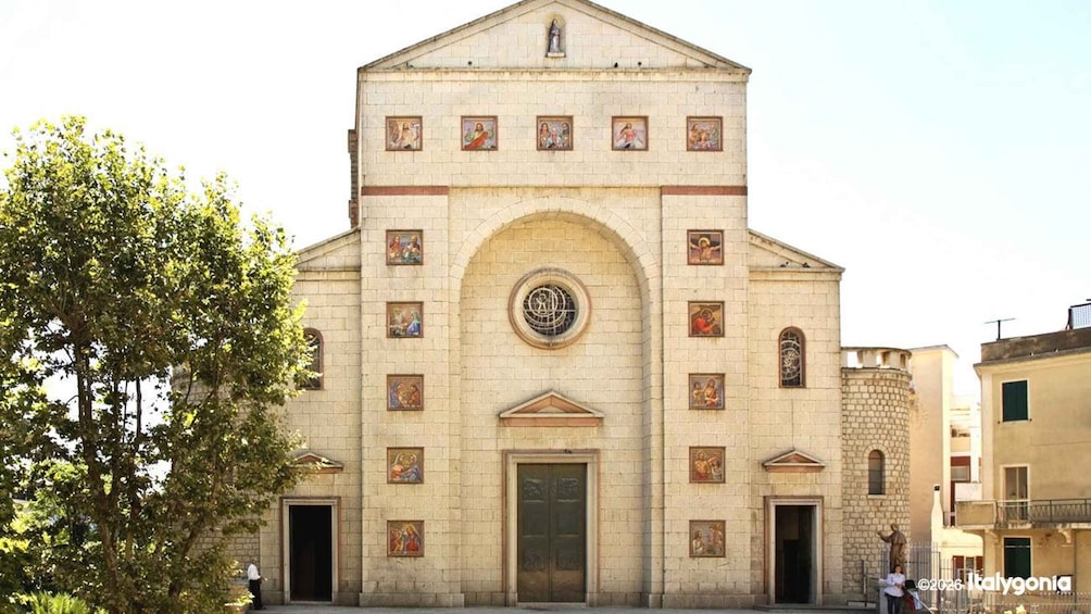 A historic church with a central dome, arched windows, and religious frescoes. 2