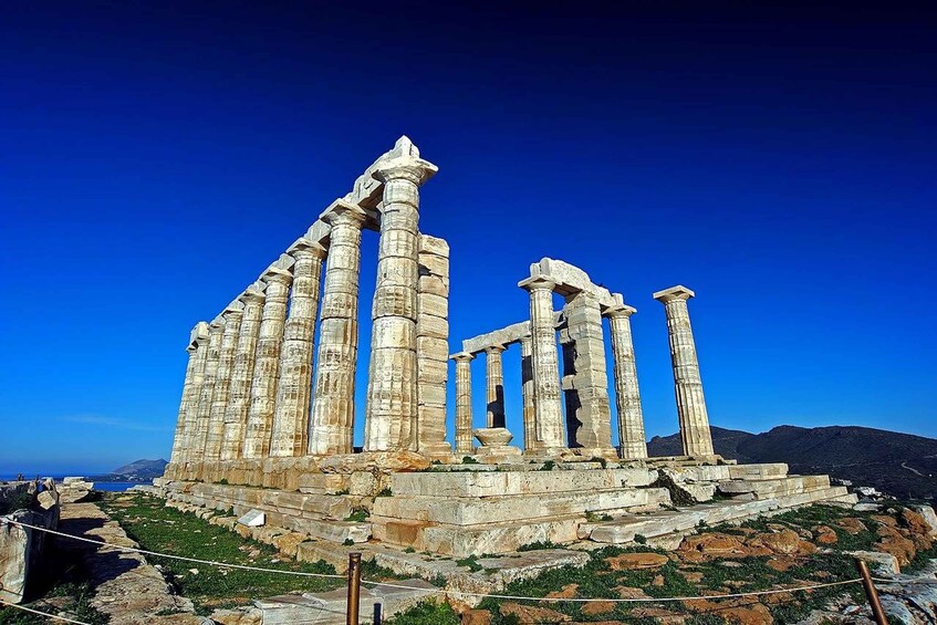Ancient ruins with columns and stone structures. 1
