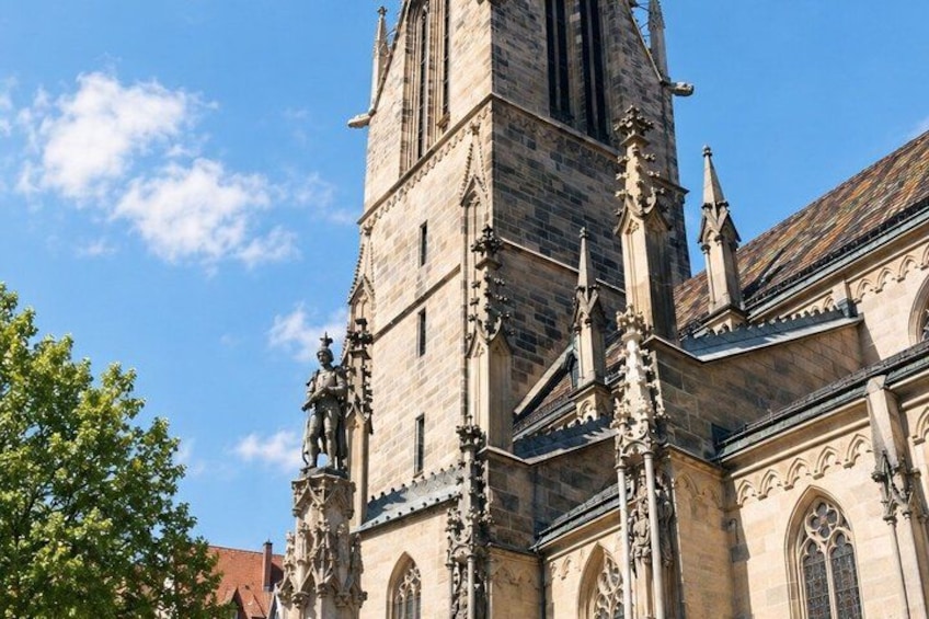 A historic church with intricate stonework and a tall bell tower. 4