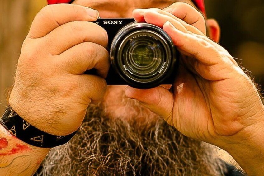 A person holding a Sony camera. 2