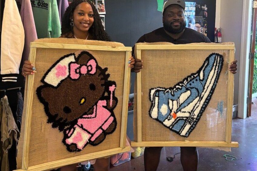 Two framed artworks, one of Hello Kitty and one of a sneaker, displayed in a store. 2