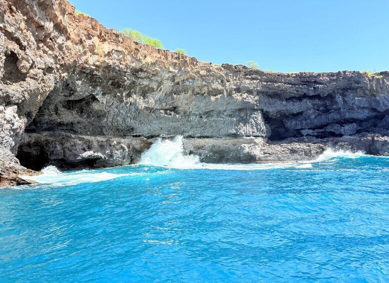 A coastal scene with a rocky cliff and crashing waves. 5
