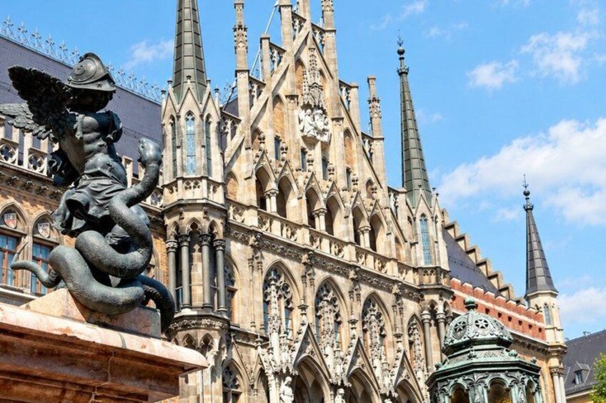 A Gothic cathedral with intricate architecture, including pointed arches and a statue of an angel. 5