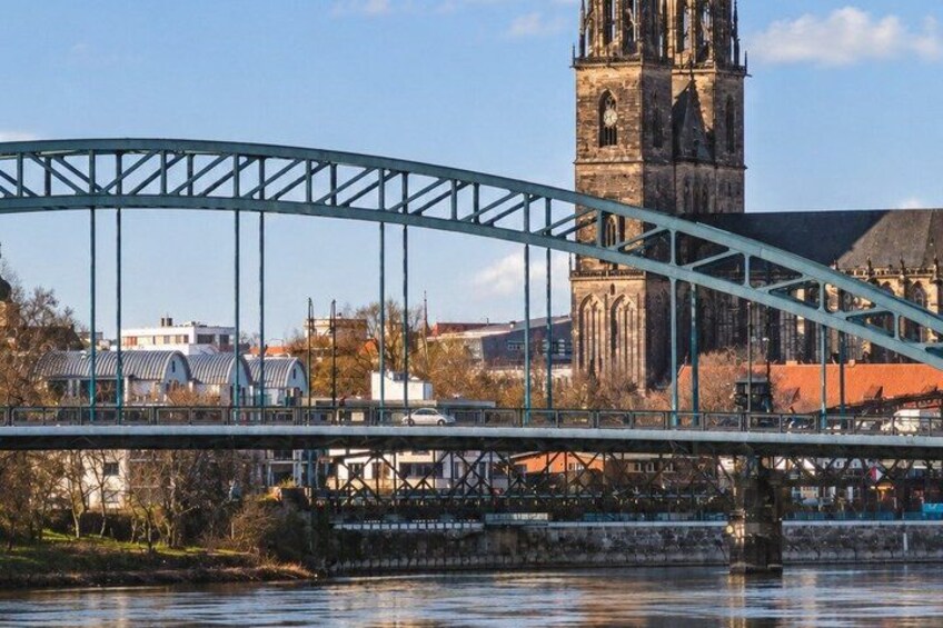 A bridge with a gothic church in the background. 3