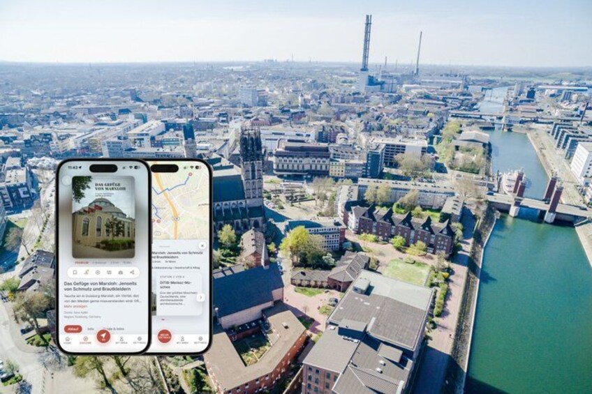 An aerial view of a city with a river, buildings, and a tall tower. 1