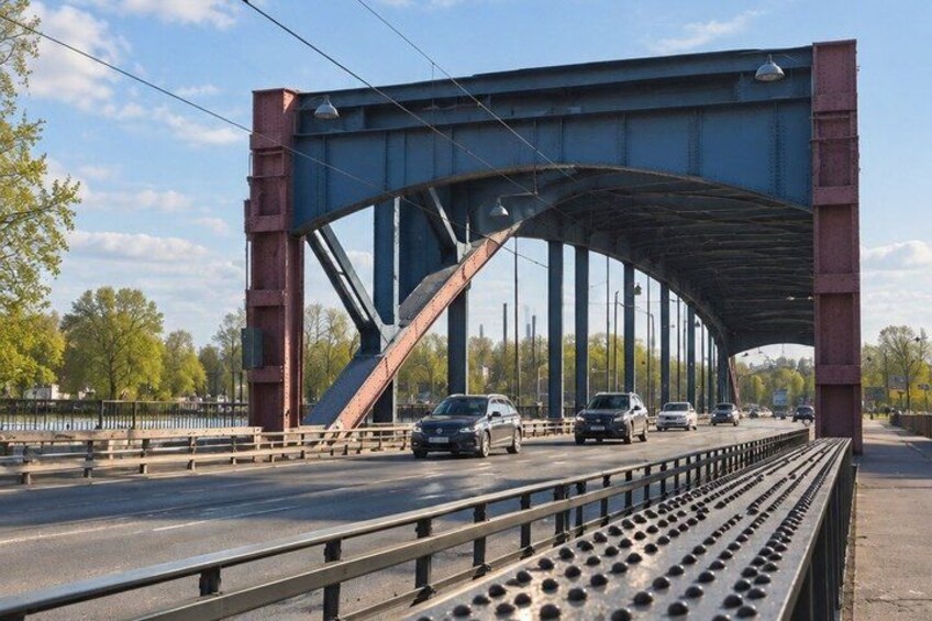 A bridge with vehicles passing underneath. 2