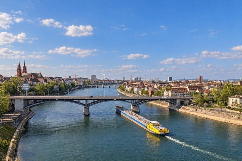 A river with a bridge and a yellow boat. 5