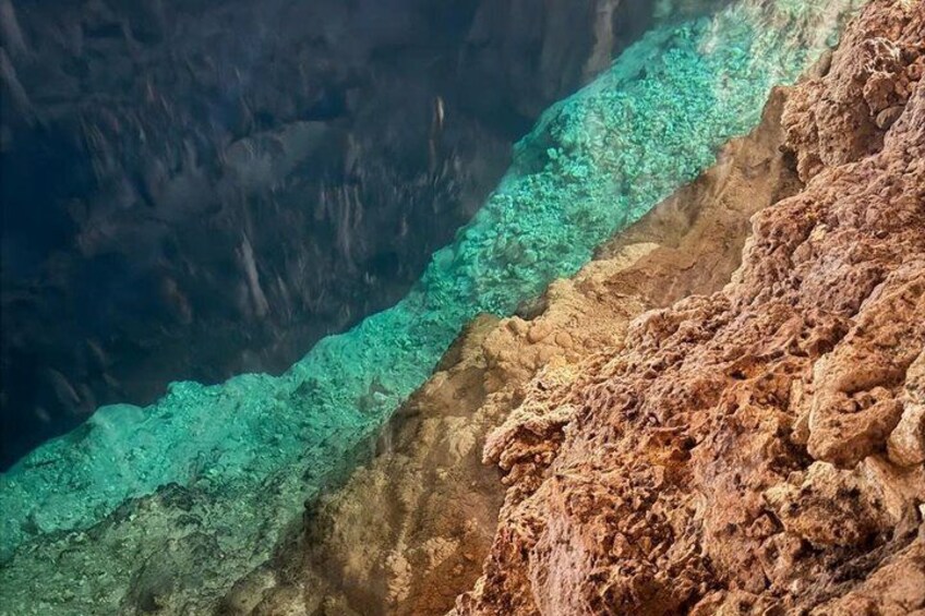 A clear water body with a rocky shoreline. 4