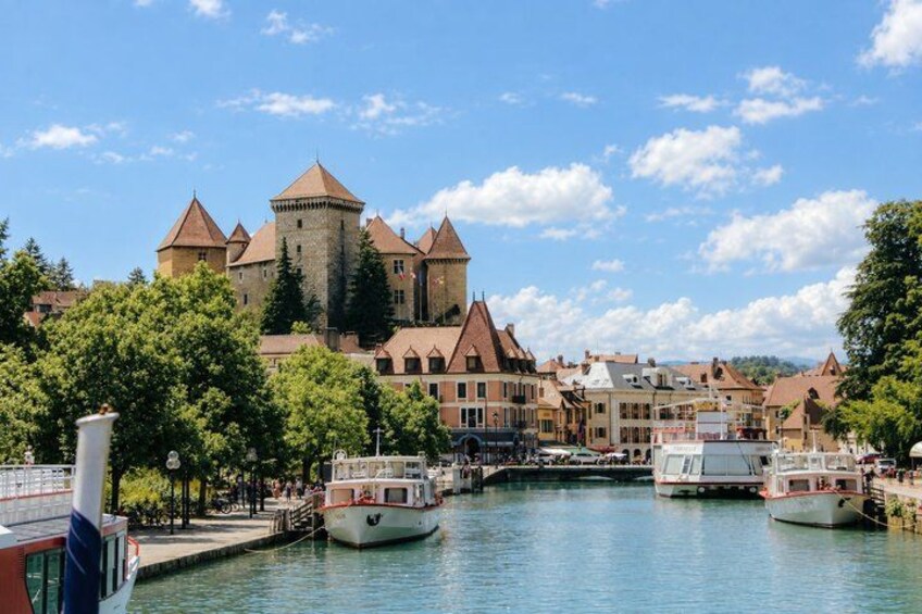 A castle, boats, and a river. 1