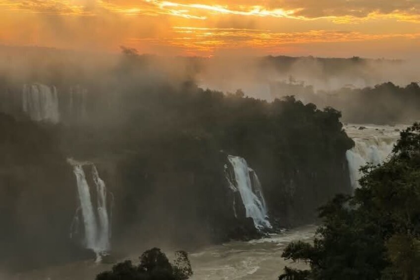 A waterfall landscape with multiple cascades and a river at the base. 4