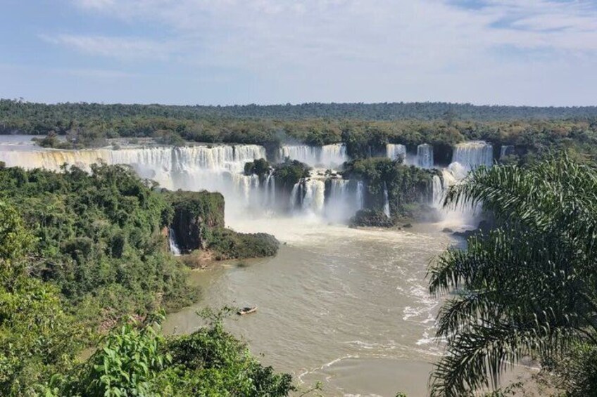 A large waterfall with multiple cascades surrounded by dense greenery. 5