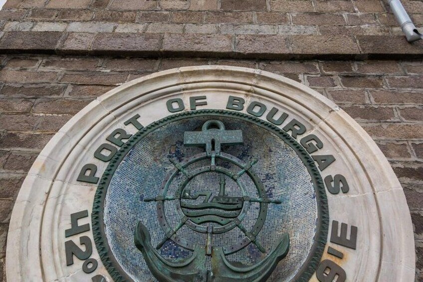 A circular plaque with the inscription 'PORT OF BOURGAS' and a nautical anchor symbol. 2