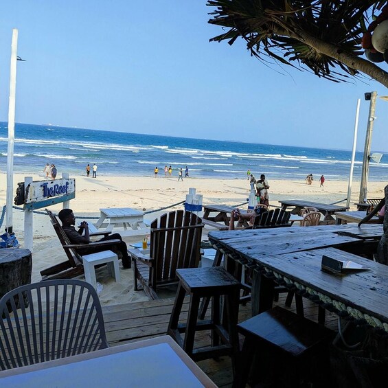 A beachside restaurant with outdoor seating overlooking the ocean. 1