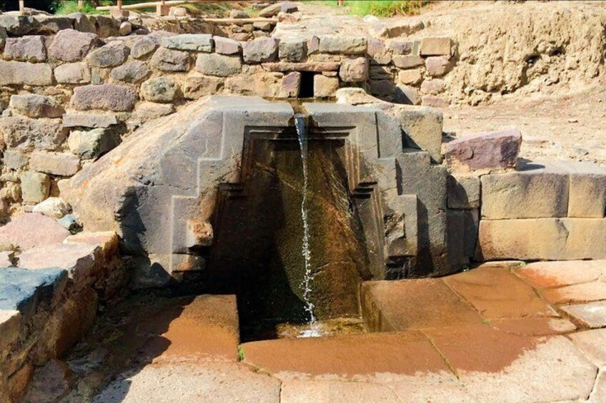A stone structure with a water channel. 2