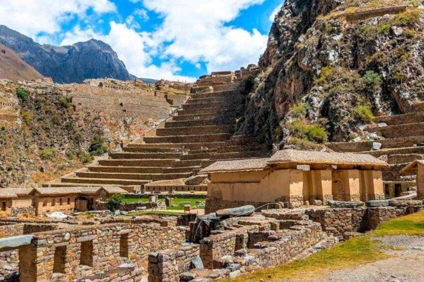 Ancient stone structures, terraced steps, and a mountainous landscape. 4