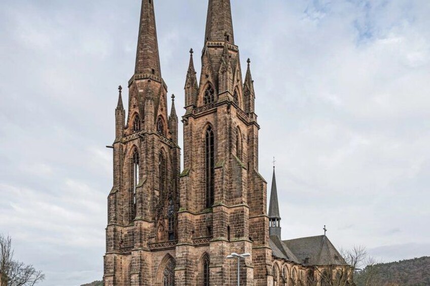 A large, historic church with multiple spires and intricate stonework. 2