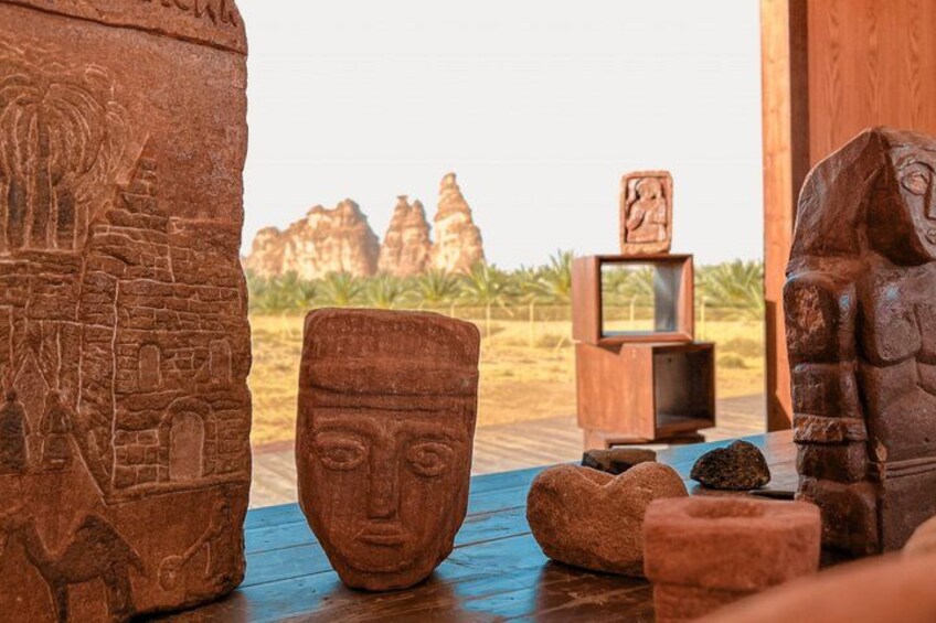A collection of carved stone artifacts, a wooden structure, and a desert landscape with rock formations. 5