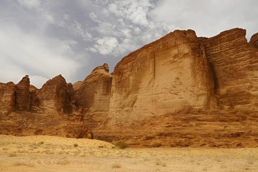 A desert landscape with prominent sandstone rock formations. 4