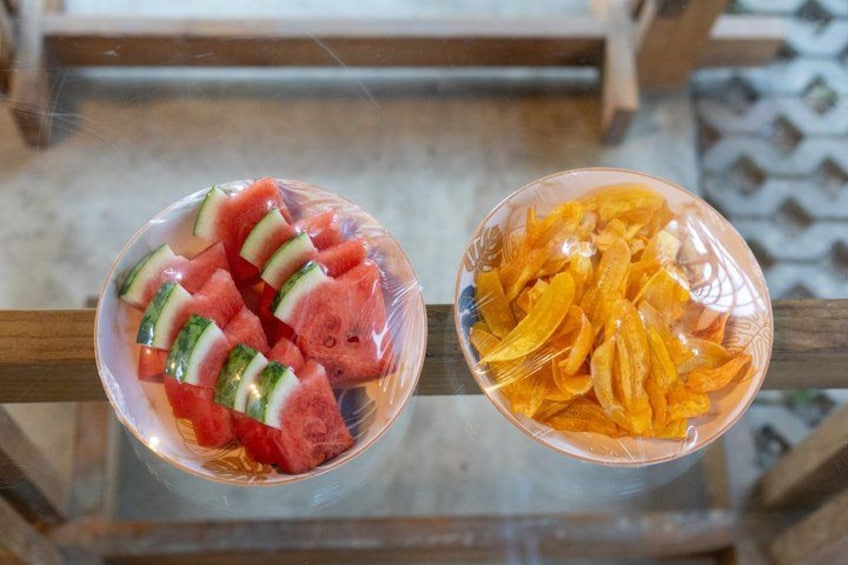 Two bowls of food on a glass table. 5