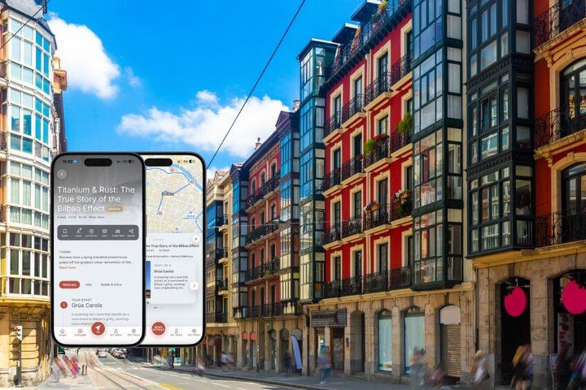 A street with colorful buildings and two smartphones displaying an app. 1