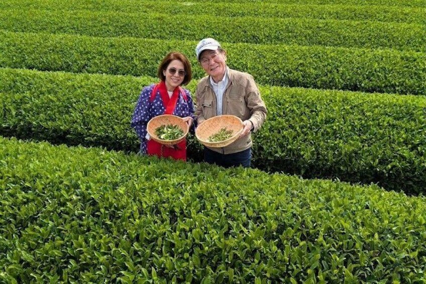 Two people holding baskets in a neatly trimmed green field. 3
