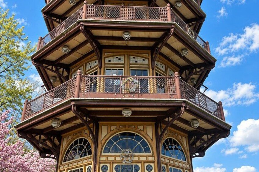 A multi-story tower with ornate balconies and large windows. 4