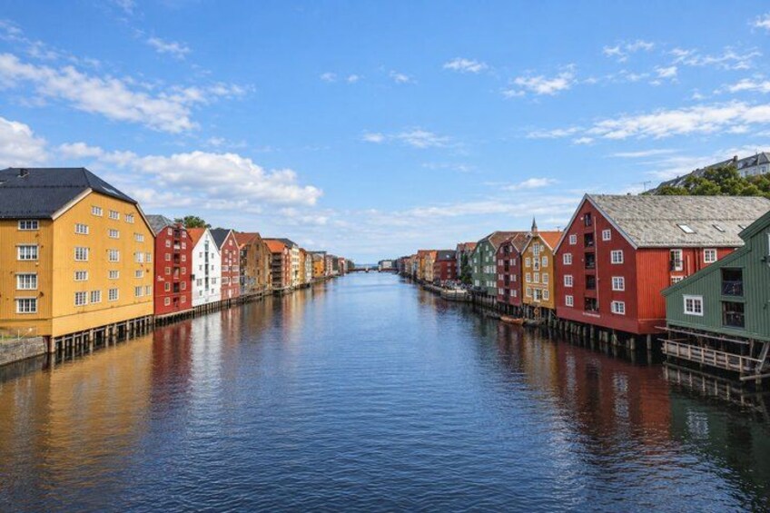 A canal with colorful buildings on either side. 4