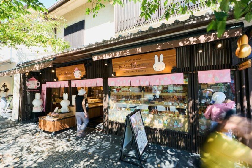 A street food stall with a signboard, a display window, and a signboard with a rabbit logo. 3
