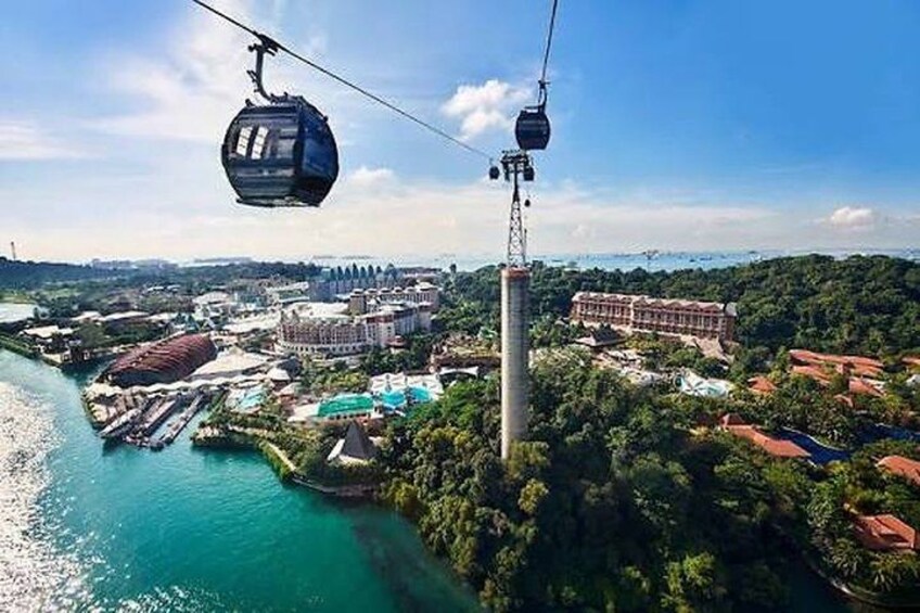 A cable car system, a river, and a cityscape with buildings and greenery. 4