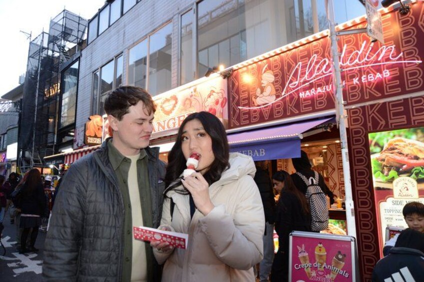 A street food vendor with a sign that reads 'Harajuku Kebabs.' 1