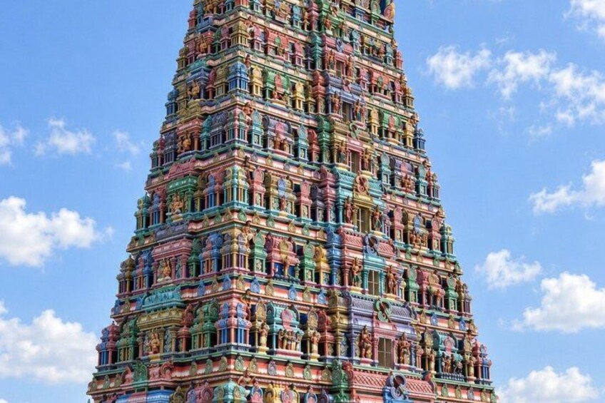 A multi-tiered temple with intricate carvings and vibrant colors. 3