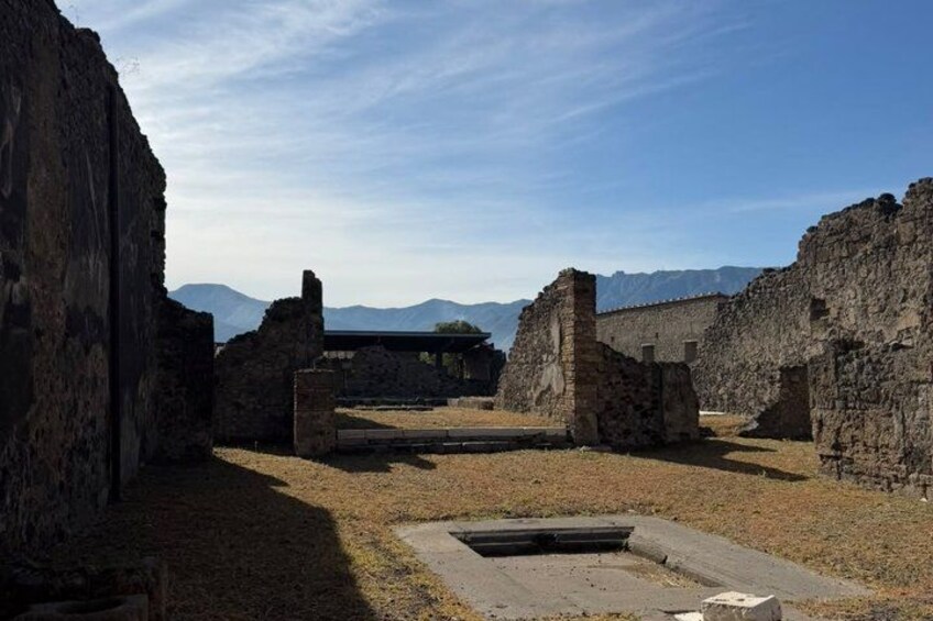 Ancient ruins with stone walls and a clear sky. 2