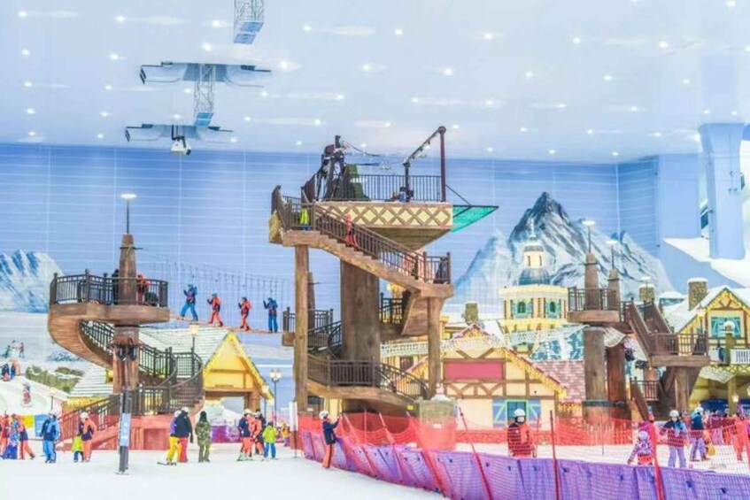 A ski resort with ski lifts, a ski slope, and various buildings. 1