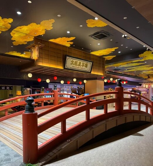 A wooden bridge with red railings, a ceiling with yellow cloud decorations, and a sign with Chinese characters. 3