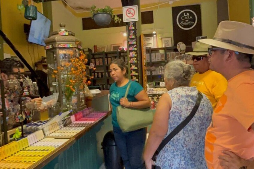 A jewelry display with various items and a person standing in front of it. 5